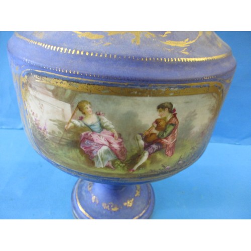 311 - A large continental ceramic lidded pot, approx. height 56cm. In good pre-owned condition with wear t... 