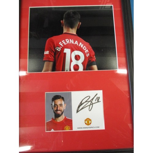 284 - A framed photo and signed card of Manchester United Number 18 B. Fernandes, approximate frame size 4... 