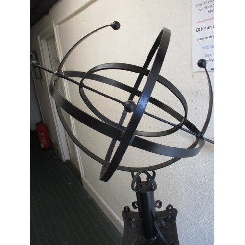 329 - A large Armillary Sphere garden sculpture, on concrete pedestal and a wrought iron top. Approximate ... 