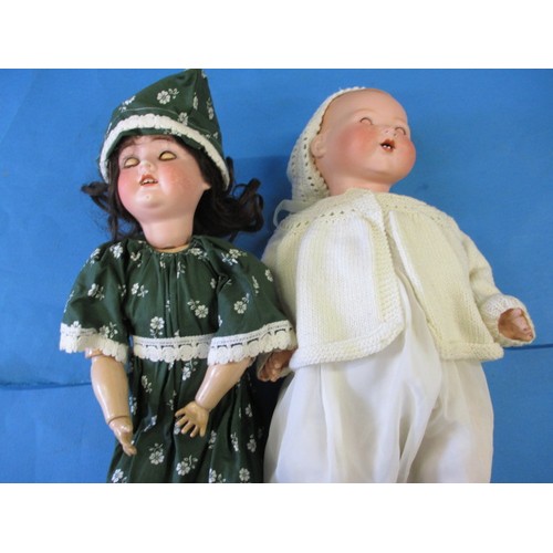 285 - 2 late 1920's German dolls, one with porcelain head by Armand Marseille. Both having benn re-strung ... 