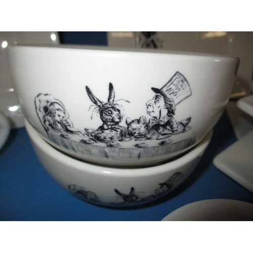 312 - A parcel of Fishs Eddy, Alice in Wonderland tablewares, to include plates, bowls and mugs, in near u... 