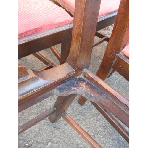 314 - A set of six early 19th Century mahogany dining chairs, with upholstered drop in pads. In good useab... 