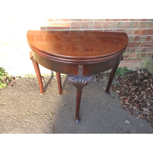 317 - An early 19th century Georgian oak tea/card table with double fold out surfaces, approx. diameter op... 