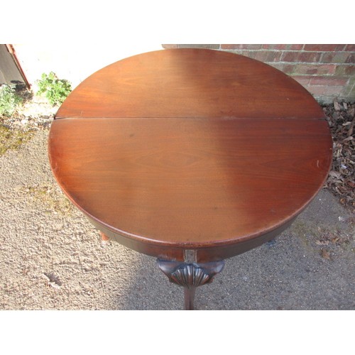 317 - An early 19th century Georgian oak tea/card table with double fold out surfaces, approx. diameter op... 