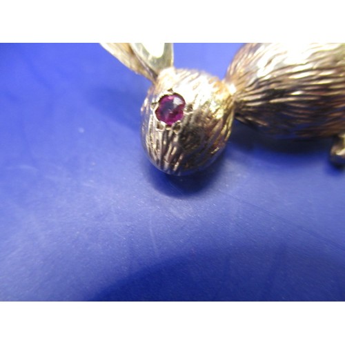 46 - A 14ct yellow gold ‘Bunny Club’ brooch with pear tail and ruby eyes, approx. weight 5.8g, in good pr... 