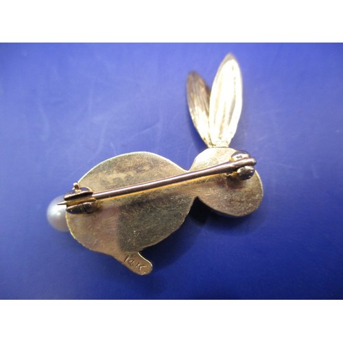 46 - A 14ct yellow gold ‘Bunny Club’ brooch with pear tail and ruby eyes, approx. weight 5.8g, in good pr... 