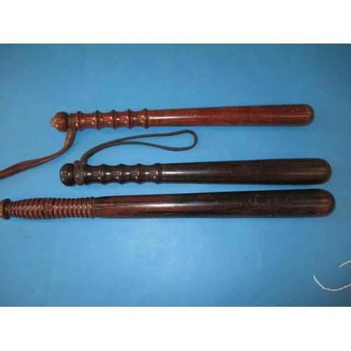 Three vintage hardwood police truncheons, in good pre-owned condition, one missing leather strap