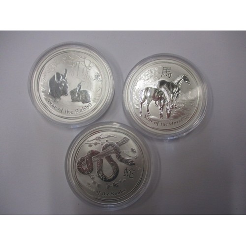 3 Australian 1oz .999 silver 1 Dollar coins, each with a Chinese year animal on the reverse
