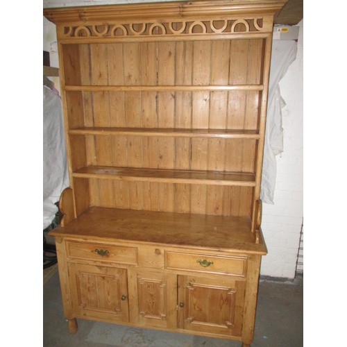 320 - A large vintage pine kitchen dresser, approx. dimensions: Height 214cm Width132cm Depth 52cm, one dr... 