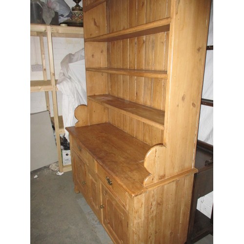 320 - A large vintage pine kitchen dresser, approx. dimensions: Height 214cm Width132cm Depth 52cm, one dr... 