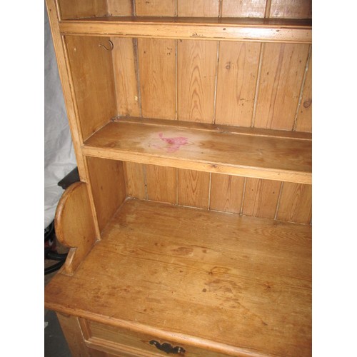 320 - A large vintage pine kitchen dresser, approx. dimensions: Height 214cm Width132cm Depth 52cm, one dr... 