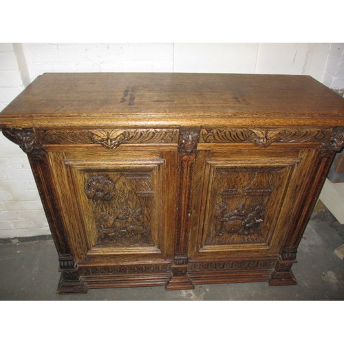 317 - A late 19th century carved oak sideboard, with 2 frieze drawers and cupboards, approx. dimensions: H... 