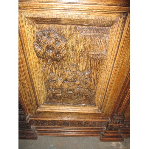 317 - A late 19th century carved oak sideboard, with 2 frieze drawers and cupboards, approx. dimensions: H... 