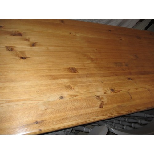 300 - A pine kitchen table with painted legs and 6 chairs, approx. dimensions: Length 179cm Width 89cm Hei... 