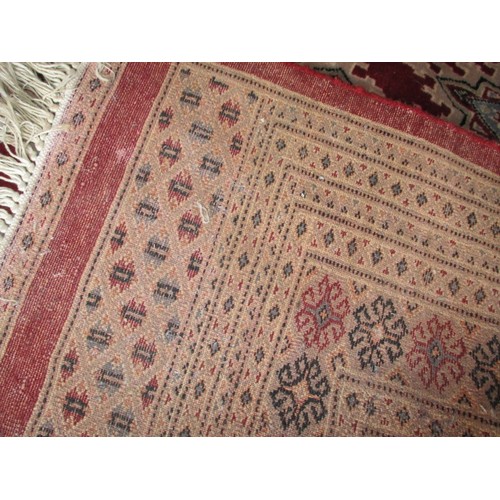 272 - A vintage hand woven Persian wool rug, approx. size  260x190cm, in useable condition with even colou... 