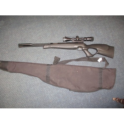 217 - A Weihrauch HW97 .22 under leaver air rifle, in near unused condition with BSA scope and gun slip