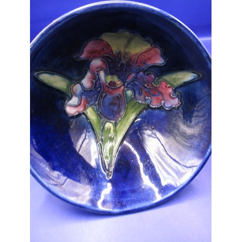 173 - Two vintage Moorcroft bowls with tube lined floral decoration on blue ground, both with no observed ... 