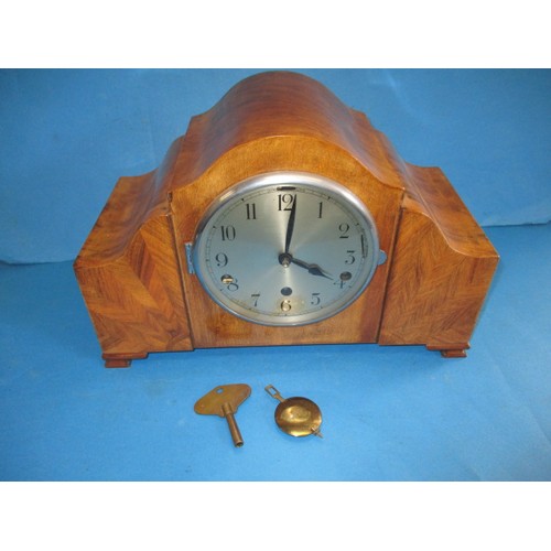 285 - A mid-century walnut cases Westminster chime mantle clock, in current working order, having geometri... 