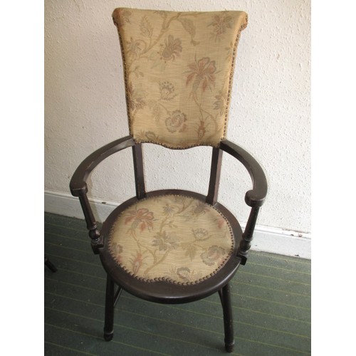 278 - Two vintage open arm chairs with upholstered seat pad and backs, both with metal labels for Trevor P... 