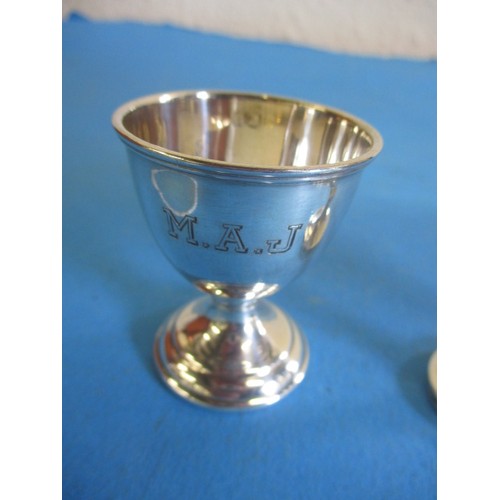 121 - Three sterling silver egg cups, various dates and makers, approx. parcel weight 69.4g, some minor de... 