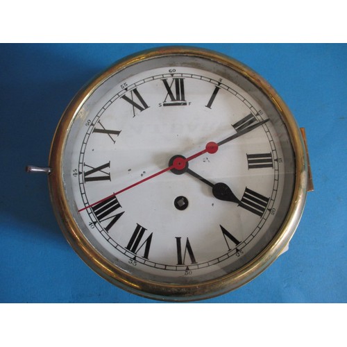 286 - An early 20th century brass and brushed steel ships style wall clock, having white enamel dial and r... 