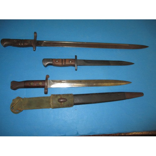 199 - 3 WWI bayonets, various lengths one with sheath, all in good condition with age-related marks