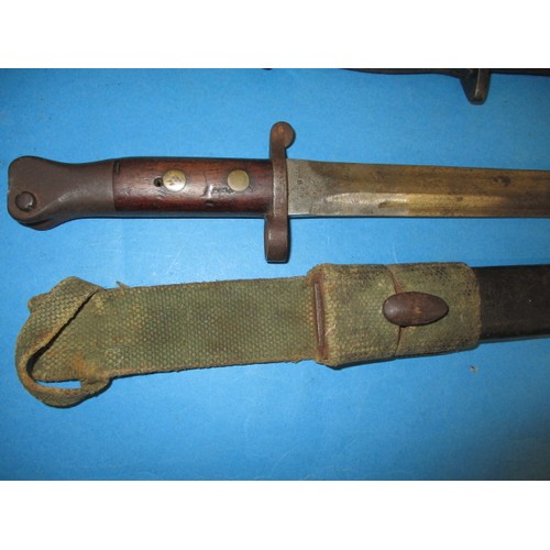 199 - 3 WWI bayonets, various lengths one with sheath, all in good condition with age-related marks