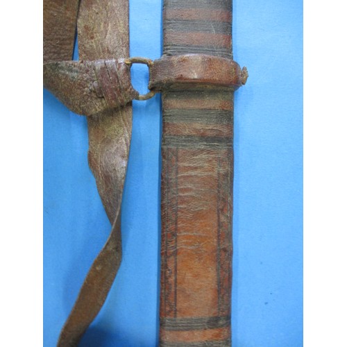 200 - A late 19th early 20th century Sahara Kaskara sword with lion mark and leather scabbard, approx. 99c... 