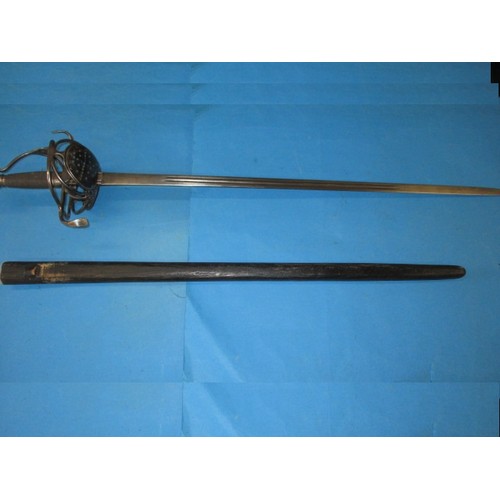 201 - An antique ‘Thurkle’ sword in later wood scabbard, approx. length 100cm in good pre-owned condition ... 