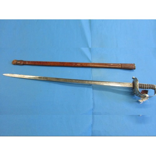 202 - An early 20th century Edward VII, cavalry dress sword with decorative etched blade, approx. length 1... 