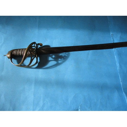 205 - An antique cavalry sword with etched blade marked H Luckman, the blade in good condition, the basket... 