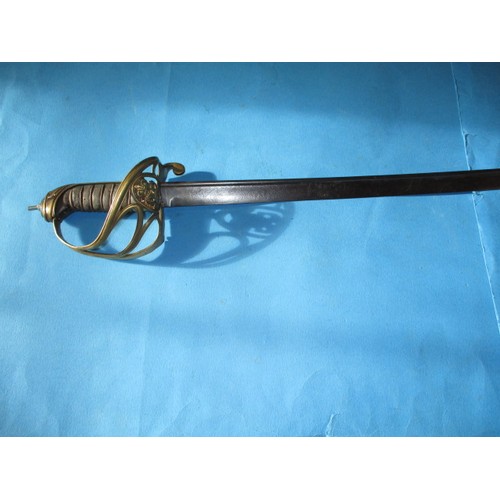 205 - An antique cavalry sword with etched blade marked H Luckman, the blade in good condition, the basket... 