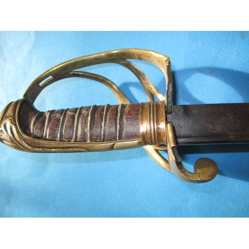 205 - An antique cavalry sword with etched blade marked H Luckman, the blade in good condition, the basket... 