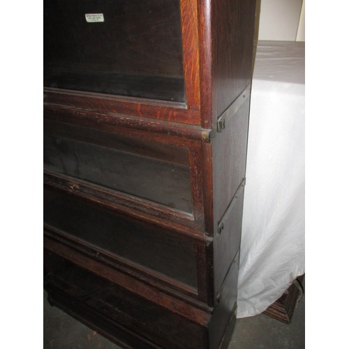 310 - A vintage four stack Globe Wernicke bookcase with top cap and bottom plinth, missing bottom door and... 