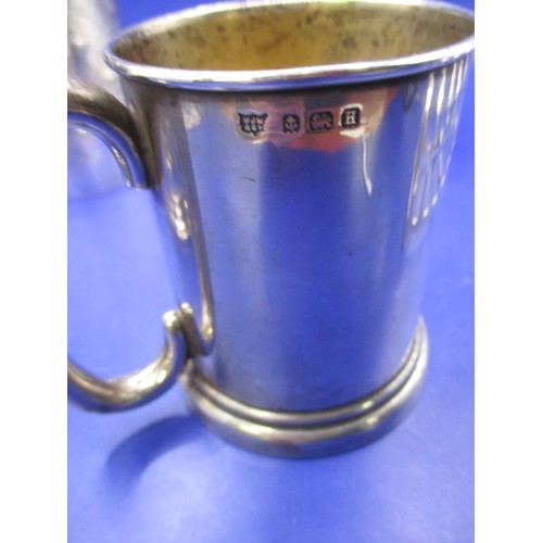 127 - A parcel of sterling silver items, to include small tankards and a toast rack. Approx. parcel, witho... 