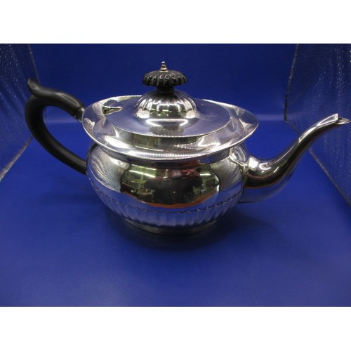 128 - An antique sterling silver and ebony handled teapot, London hallmark. In good used condition, with a... 