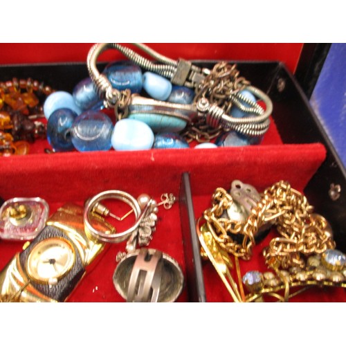 152 - A vintage jewellery box with contents, to include numerous necklaces, rings and brooches, all in use... 