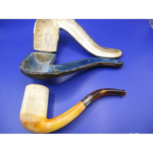 165 - An antique Meerschaum pipe with amber? Mouthpiece and silver collar, in original fitted case and in ... 