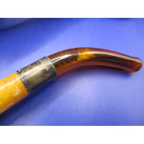 165 - An antique Meerschaum pipe with amber? Mouthpiece and silver collar, in original fitted case and in ... 