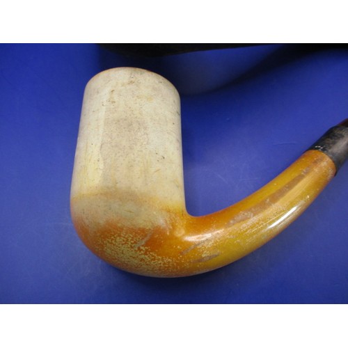 165 - An antique Meerschaum pipe with amber? Mouthpiece and silver collar, in original fitted case and in ... 