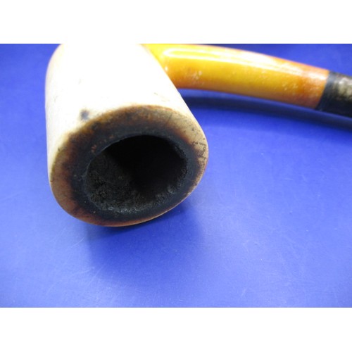 165 - An antique Meerschaum pipe with amber? Mouthpiece and silver collar, in original fitted case and in ... 