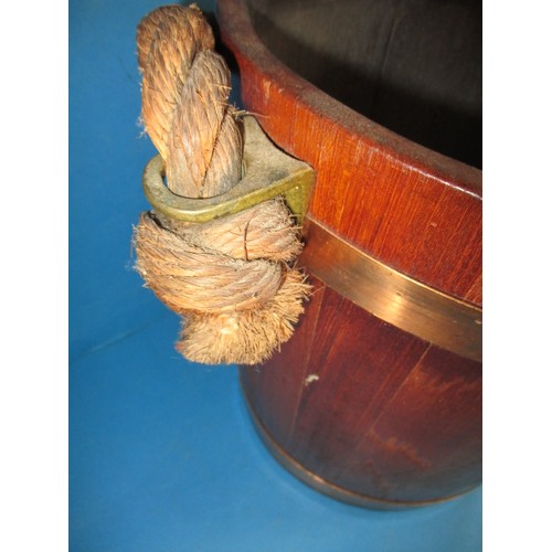 318 - A vintage teak bucket with copper and brass mounts with decorative crest to front, in good pre-owned... 