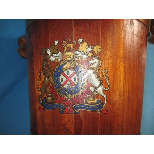 318 - A vintage teak bucket with copper and brass mounts with decorative crest to front, in good pre-owned... 