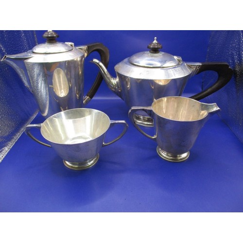 133 - An art deco sterling silver 4 piece tea set, hallmark for 1935 London Makers mark for Reid & Sons Ne... 