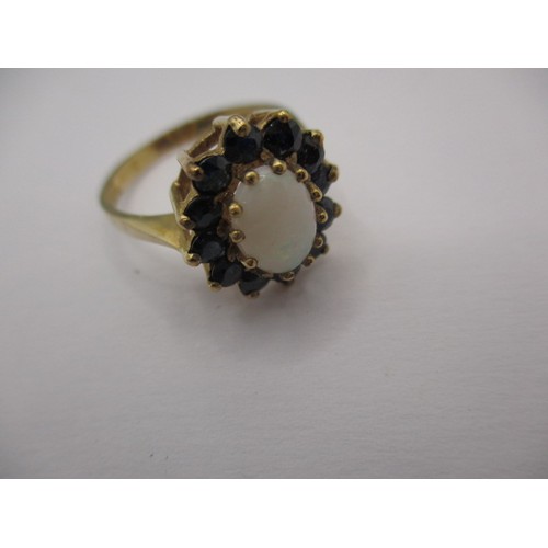17 - A 9ct yellow gold, sapphire and opal daisy ring, approx. ring size ‘N’ approx. weight 2.6g in good p... 