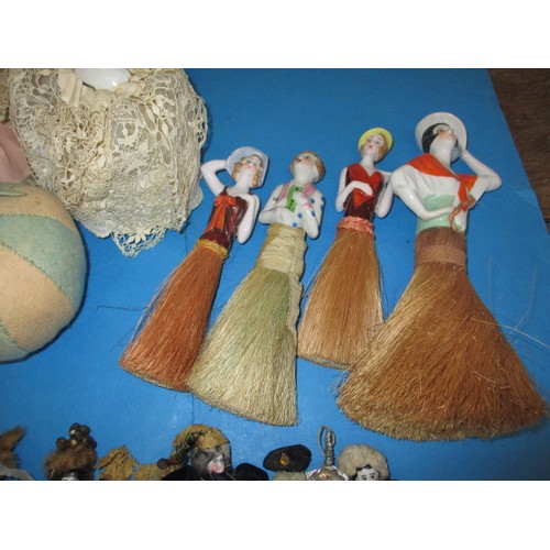 255 - A collection of antique and later porcelain half dolls, some made in to pin cushions and some in to ... 