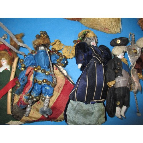 255 - A collection of antique and later porcelain half dolls, some made in to pin cushions and some in to ... 