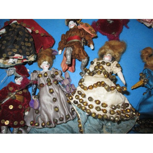 255 - A collection of antique and later porcelain half dolls, some made in to pin cushions and some in to ... 