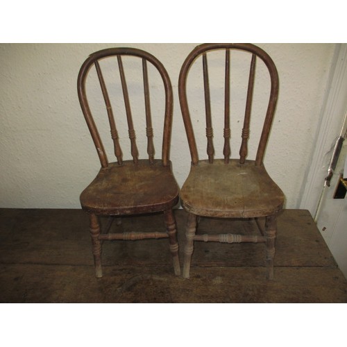 302 - A pair of antique child’s hoop back chairs, approx. height 57cm both in good used condition with old... 