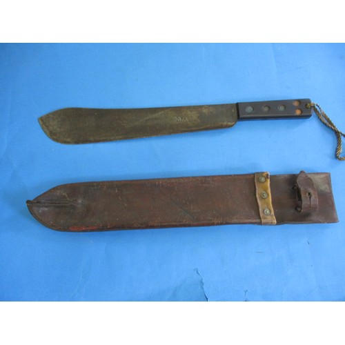 208 - A WWII machete with crows foot mark and original leather scabbard, in used condition, approx. length... 